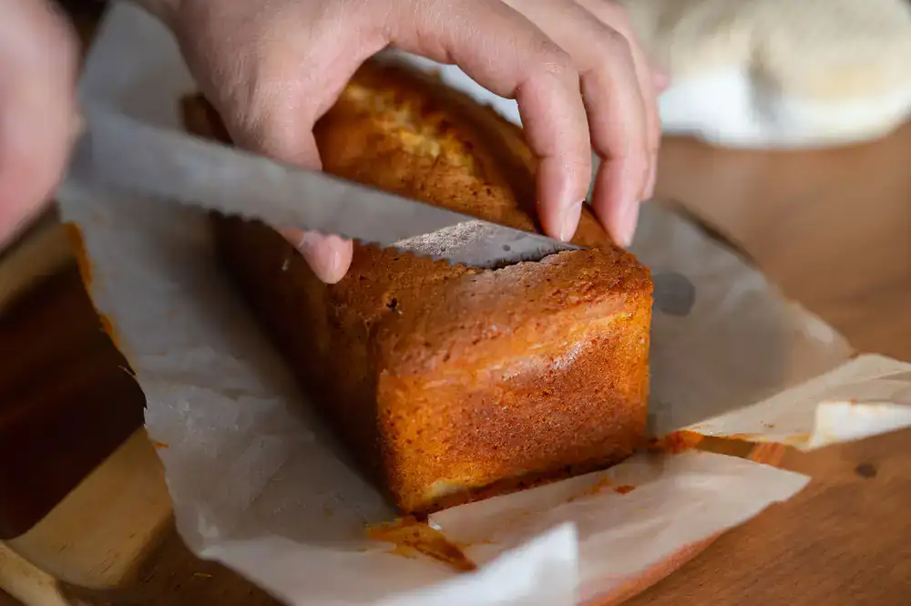 Hand-cutting a freshly cured loaf of cold process soap